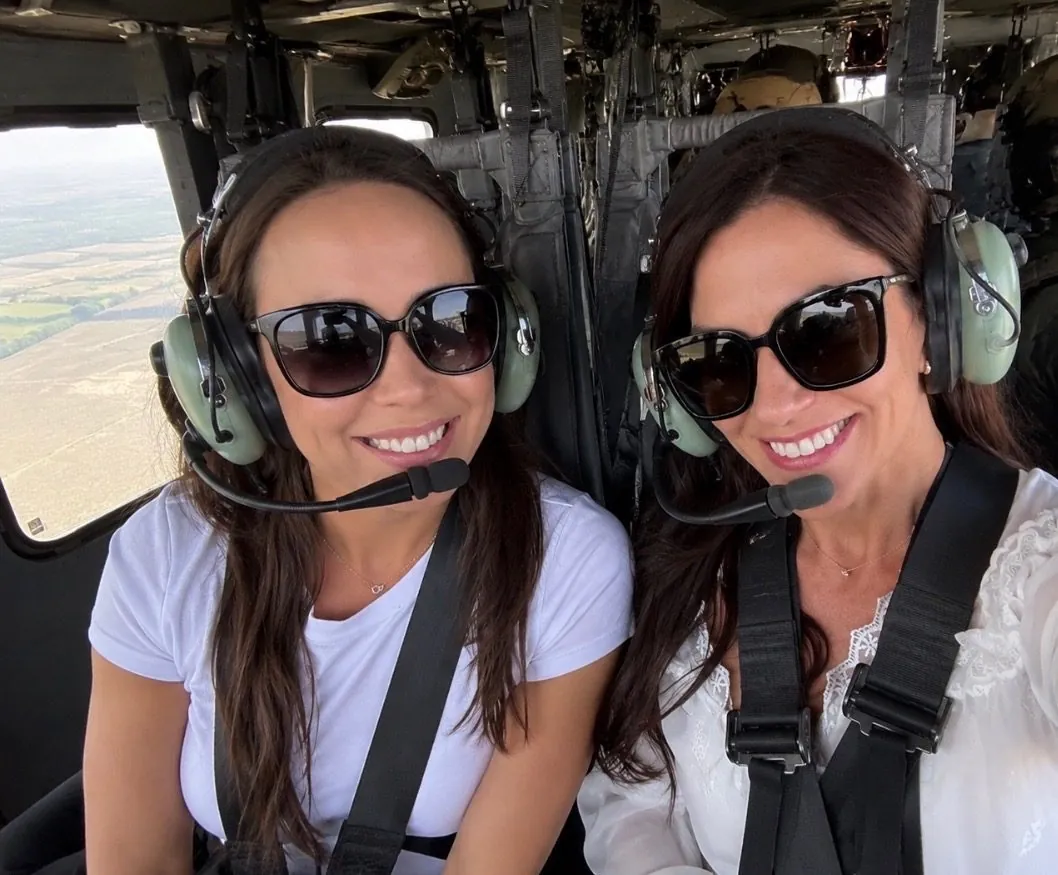 Jackie and Nikki, the founders of Gigogram, in headsets on a helicopter flight